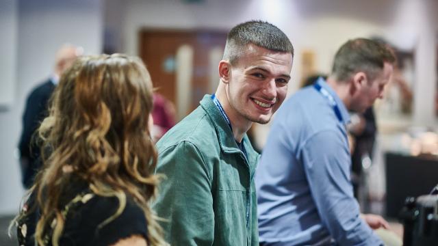man looking at camera for get involved